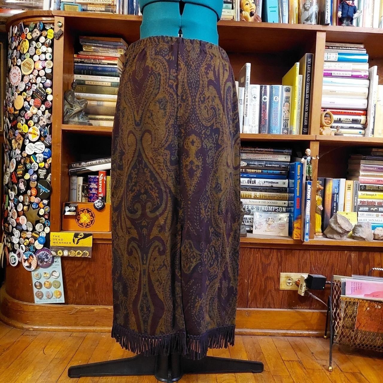 Vintage purple, green, and brown knit paisley skirt with fringe detail.